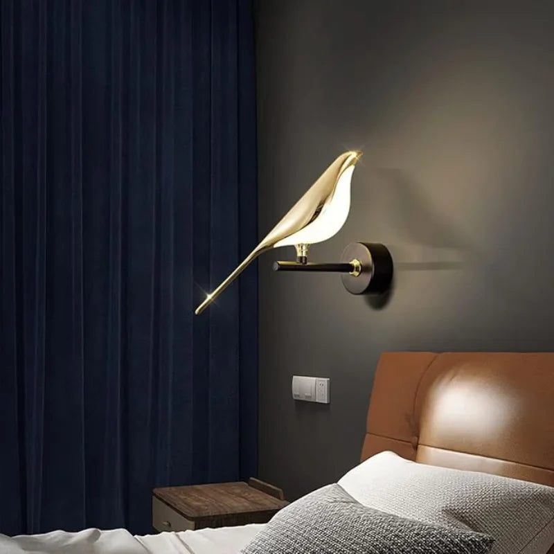 Modern-bird-wall-light-on-black-and-gold-base

