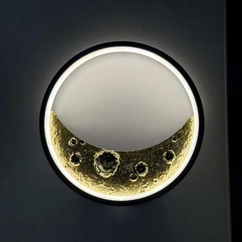 Moon-themed-wall-light-with-gold-crater-design

