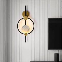 Nordic-bedside-wall-light-with-black-and-gold-frame

